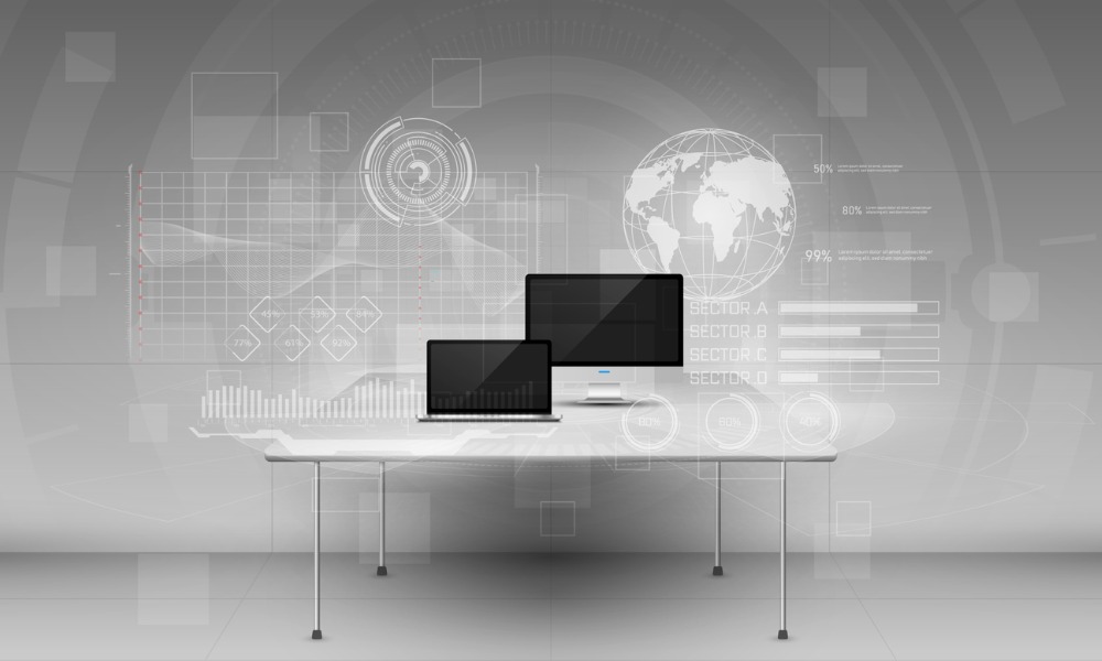 Grey background showing a world map with connectivity and in front on a table are two computer devices.