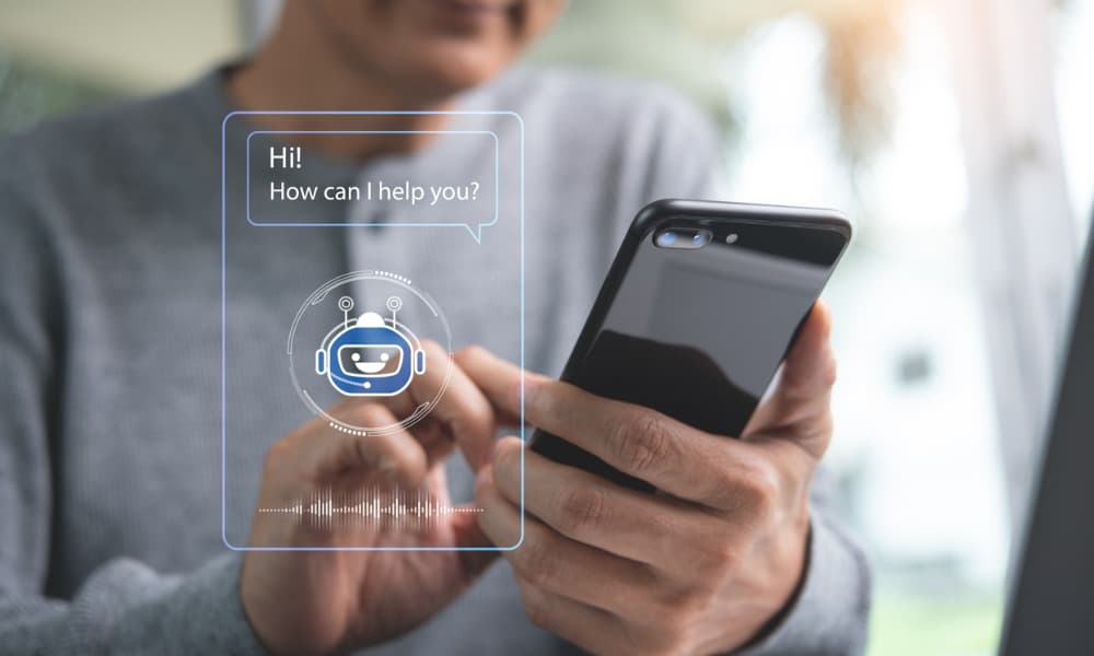 The image shows a person holding a phone and chatting with a chatbot app.